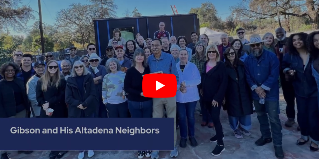 Photo of a group of people outside an Altadena rebuild after the wildfires.